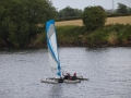 Canoe with outriggers and a sail